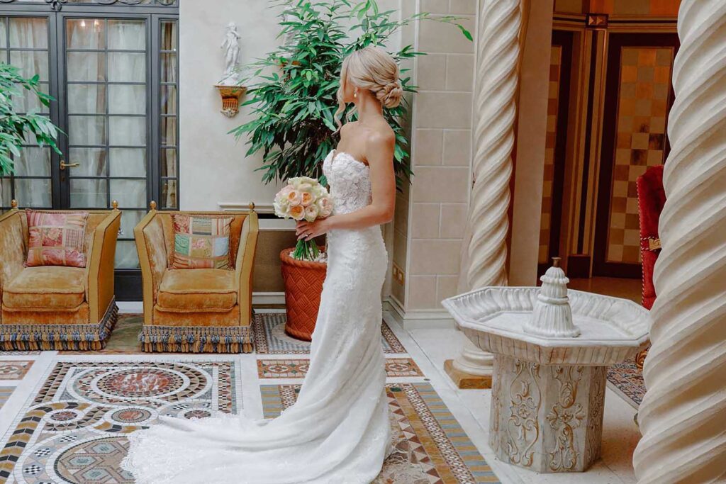 Bride portrait in courtyard during Lake Maggiore wedding with soft natural light and vintage tones