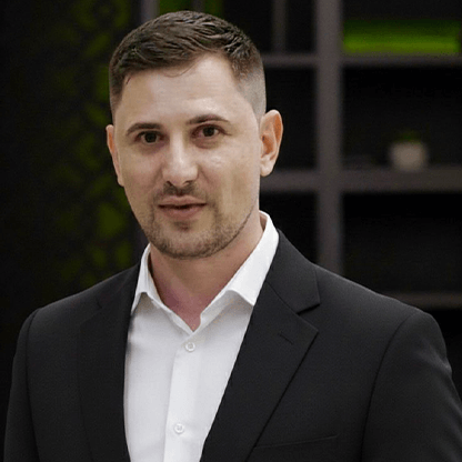 Denis from Image Studio, professional portrait of creative studio team member in modern office setting