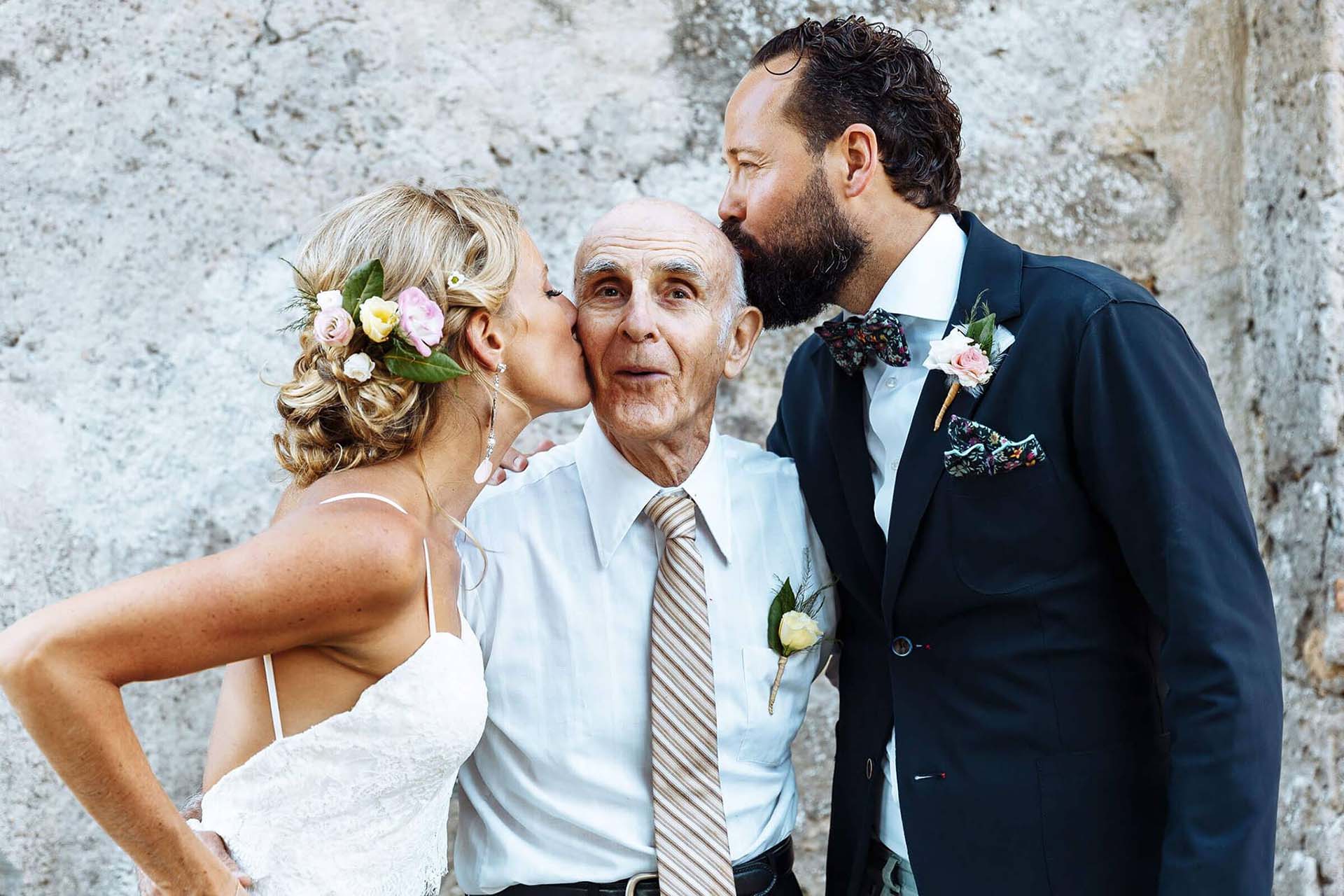 Bride Amy and groom Djin raising glasses during a wedding speech at Borgo di Tragliata.