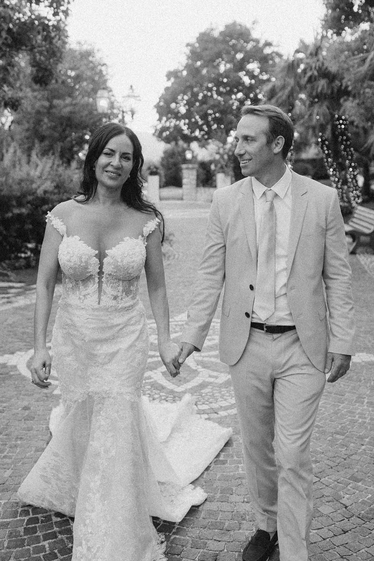 Bride and groom walking together at La Grotte Resort during wedding
