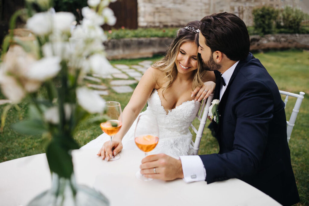 Bride and groom enjoying an Italian aperitivo during their wedding at Castello di Rossino in Italy