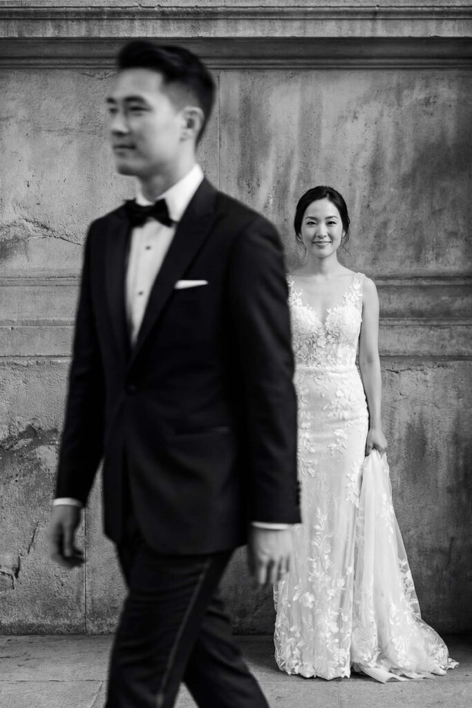 Black and white editorial wedding portrait of bride and groom in Italy with elegant architectural background