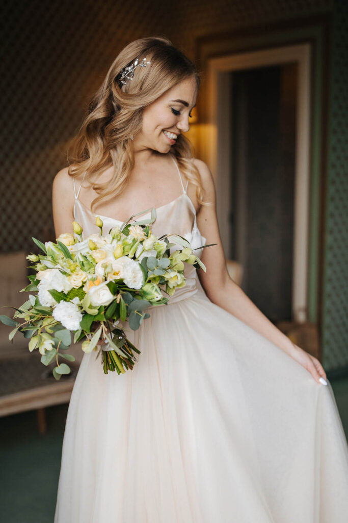 Elegant bride portrait holding bouquet inside Grand Hotel Villa Castagnola in Lugano, Switzerland
