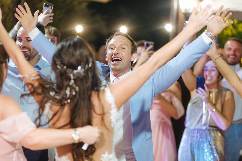 Wedding guests celebrating and dancing during reception at La Grotte Resort in Valle di Comino, Italy