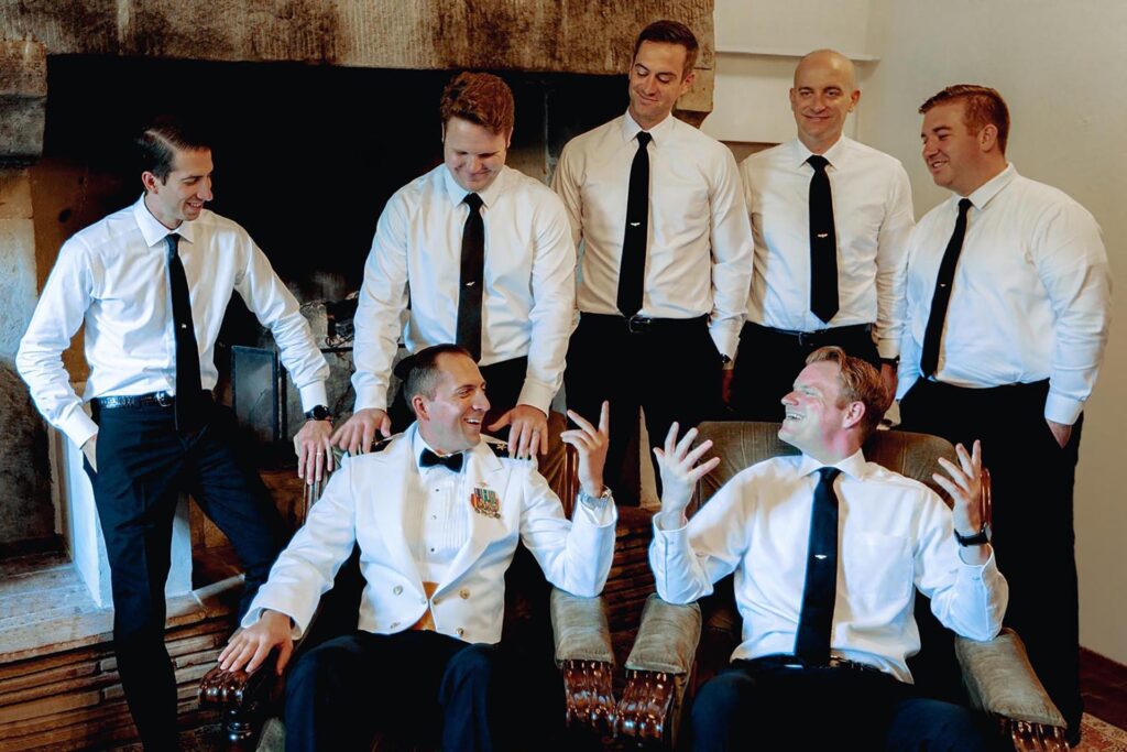 Groom with groomsmen during wedding preparation at Castello di Ristonchi in Tuscany, Italy