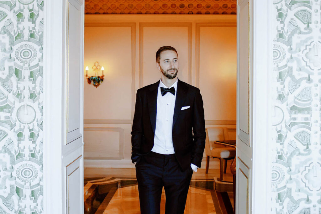Elegant groom in black tuxedo at Hotel Villa e Palazzo Aminta in Stresa, Lake Maggiore
