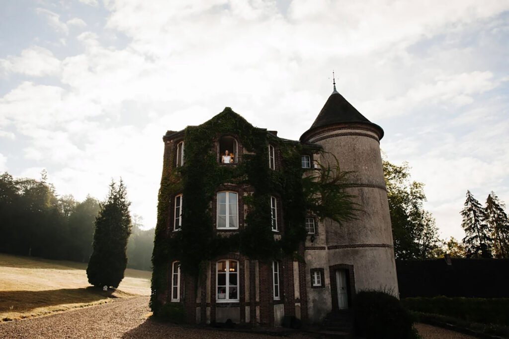 Historic ivy-covered château near Paris, France, used as a luxury destination wedding venue