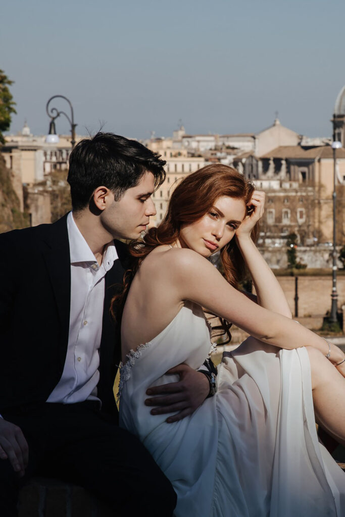 Elegant couple portrait in Rome, Italy with historic cityscape background