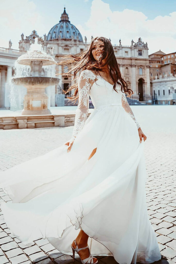 Bride in flowing wedding dress in front of St. Peter’s Basilica in Vatican City, Rome