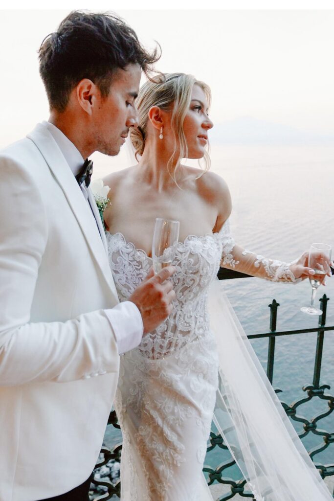 Luxury wedding couple at Villa Antiche Mura in Sorrento overlooking the sea during sunset reception