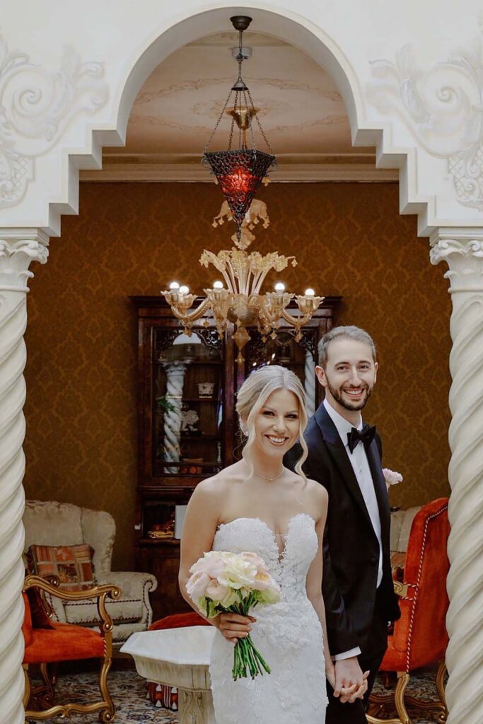 Bride and groom inside Villa e Palazzo Aminta in Lake Maggiore during a luxury destination wedding in Italy
