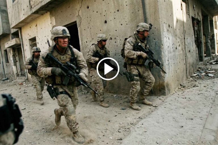 Mortal Reminder movie trailer scene showing an intense action character holding a gun in a cinematic close-up