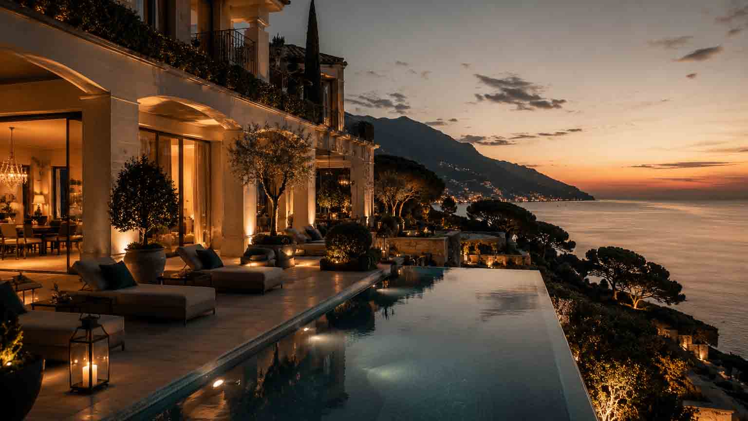 Luxury Mediterranean villa overlooking the sea with infinity pool, cinematic sunset lighting and elegant destination venue atmosphere.